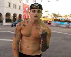 He has several tattoos on his body parts including on his arms, back, shoulder, etc.